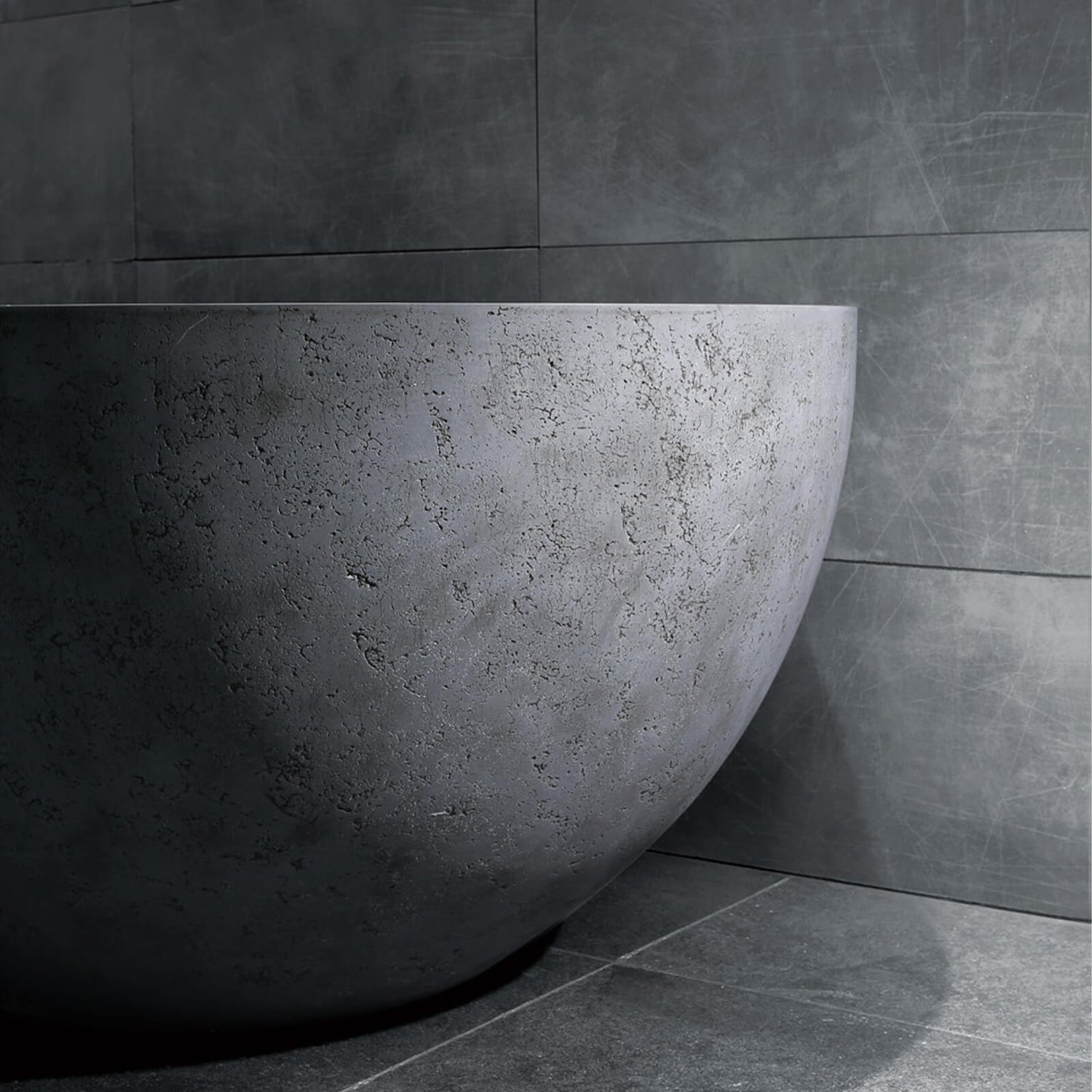 67 inch freestanding bathtub in a rugged concrete industrial finish