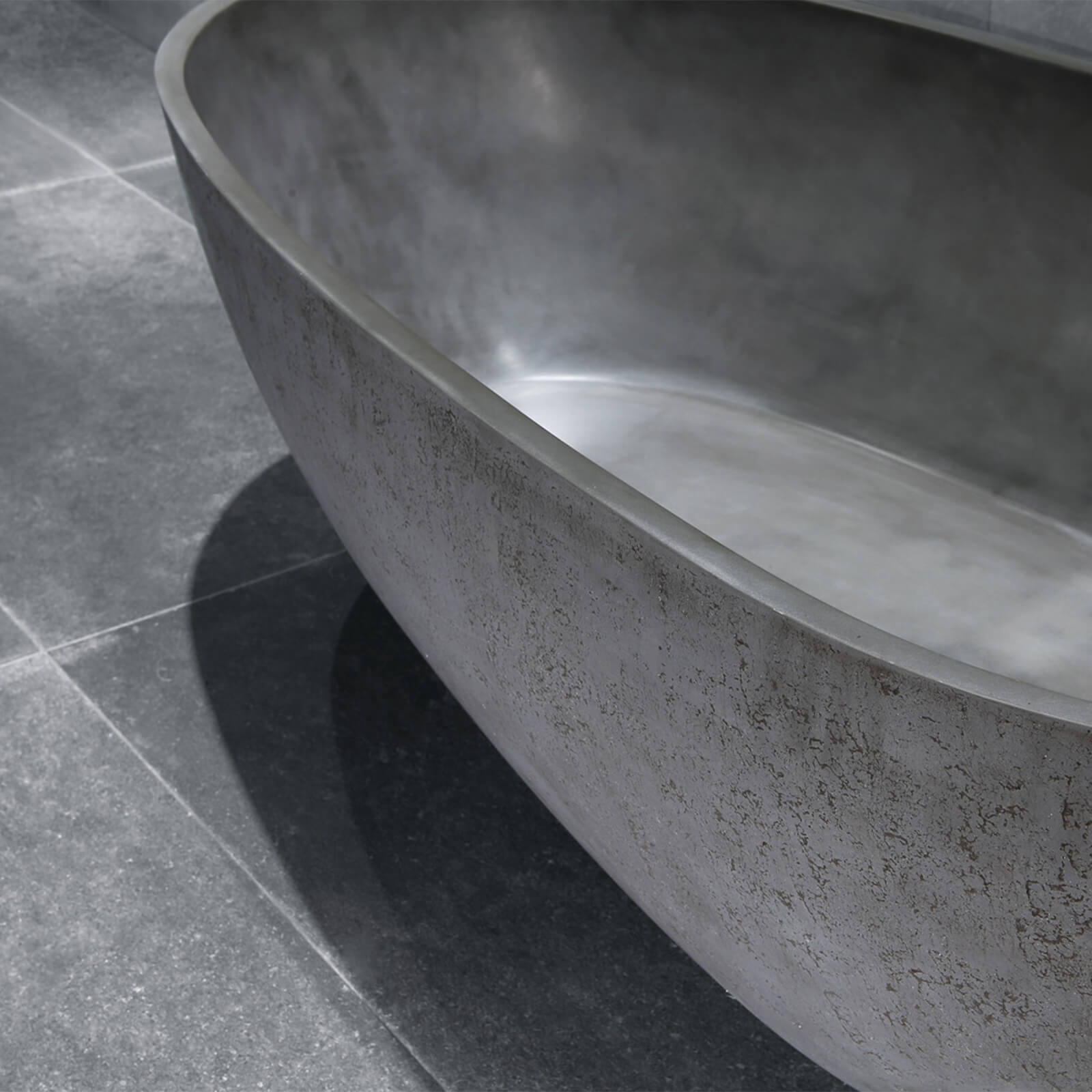 Premium industrial bathtub in matte concrete finish with artistic design